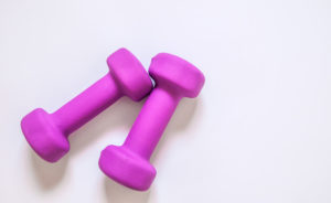 Purple dumbbells, fitness concept isolated on white background, fitness concept isolated on white background, sport, body building. Concept healthy lifestyle, sport and diet. Sport equipment. Copy space