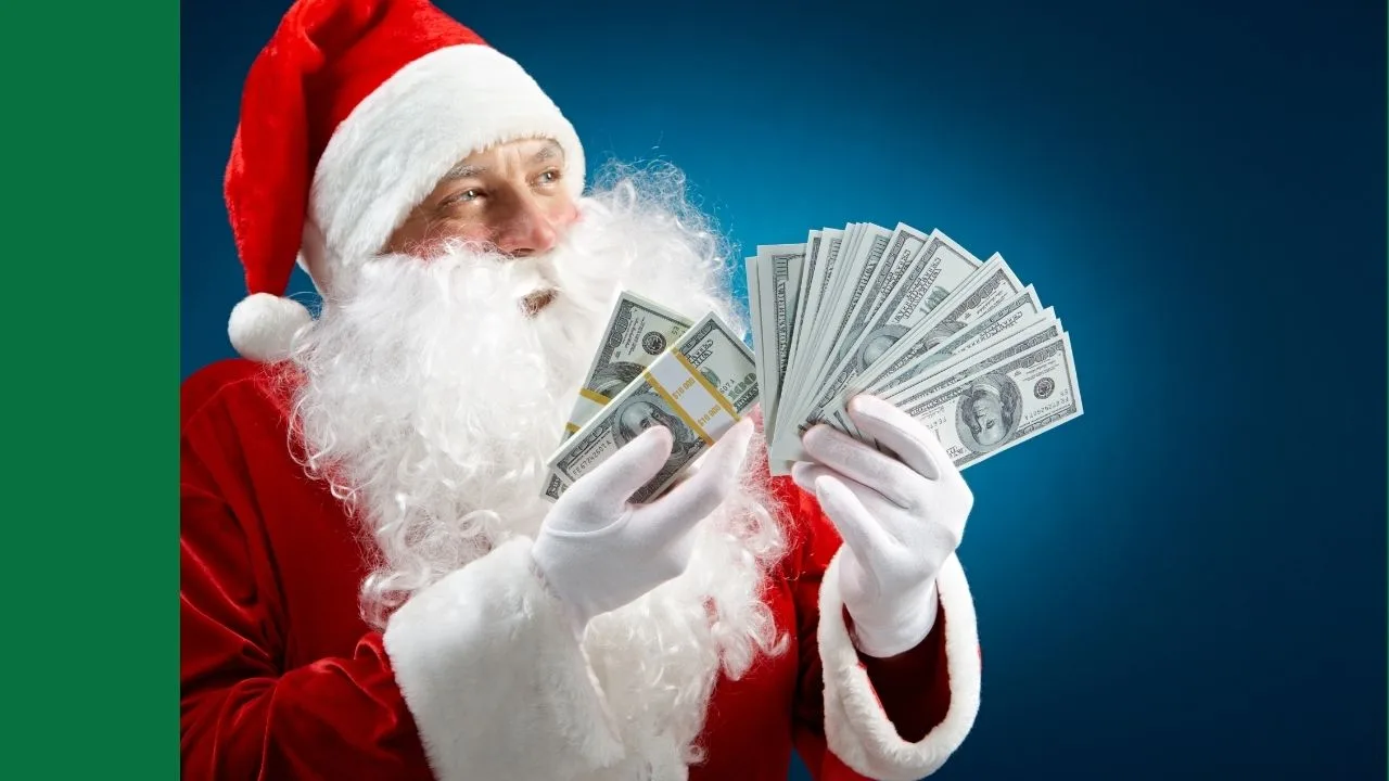 Santa Claus holding US dollars